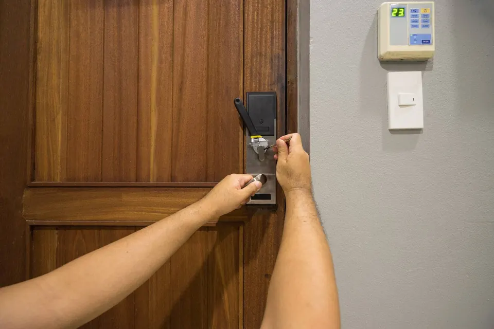Door lock hardware being checked at an entrance